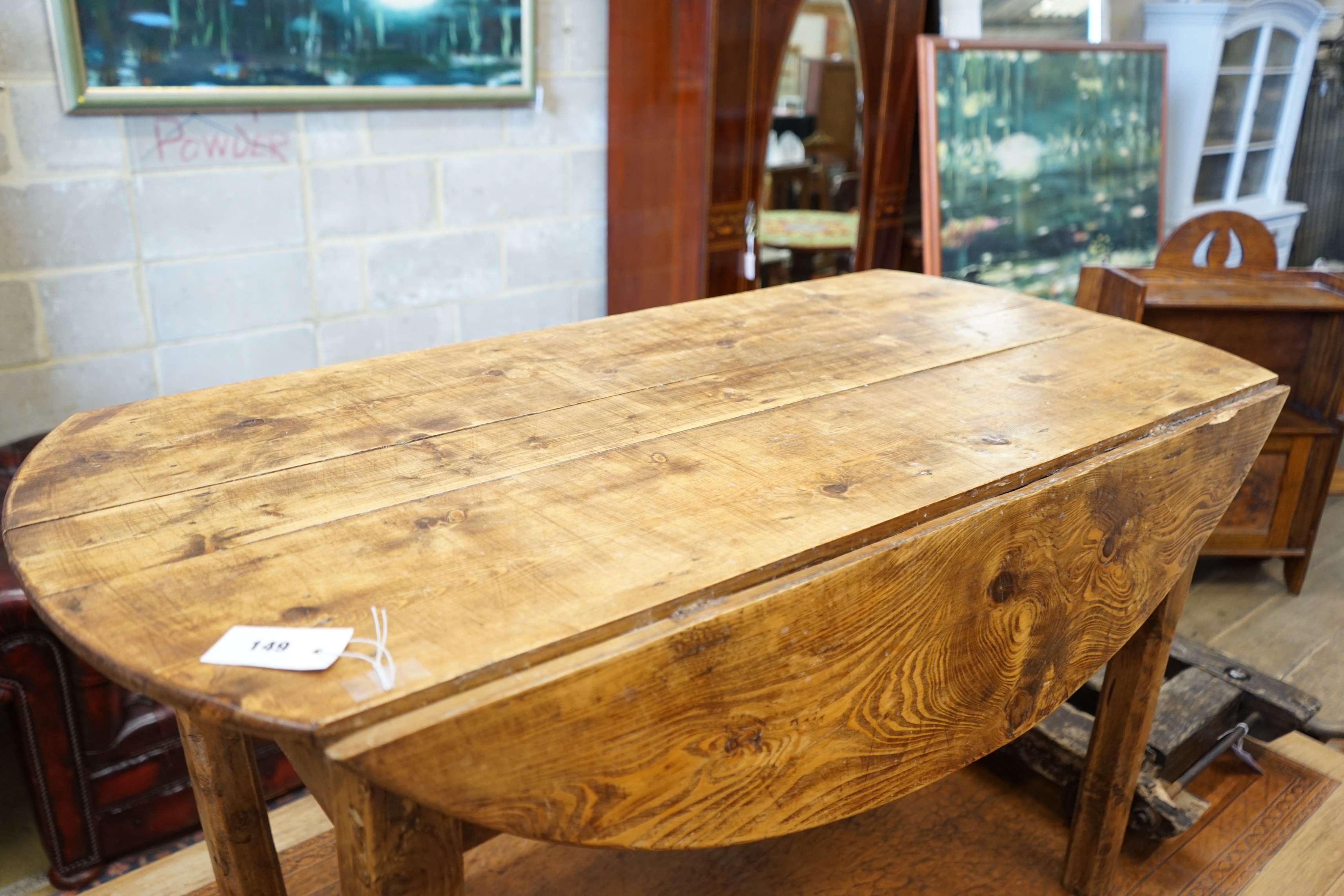 A 19th century provincial elm drop flap kitchen table, length 117cm, width 57cm, height 69cm